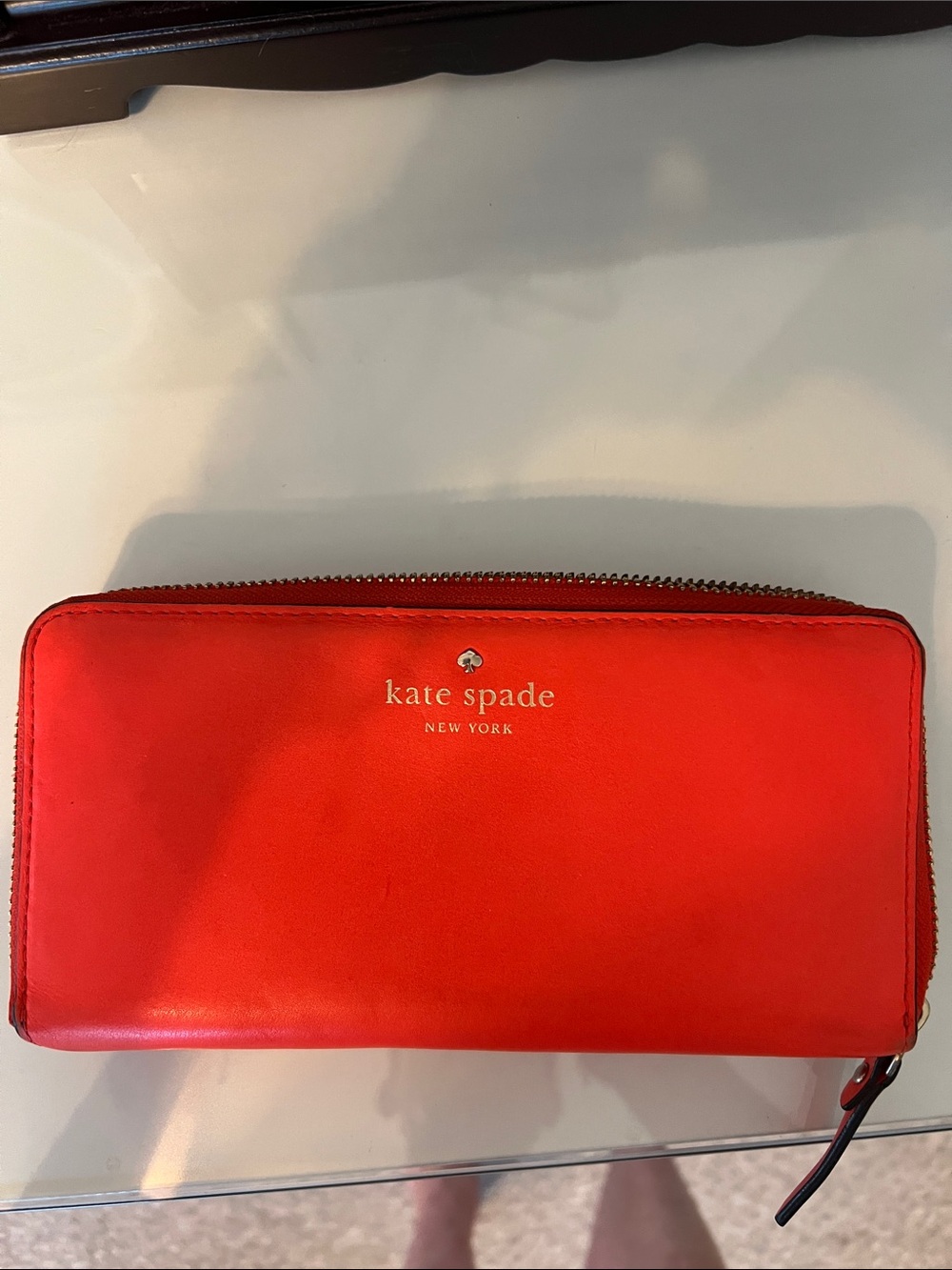 kate spade bright orange zip-around large Stacicontinental wallet with gold logo